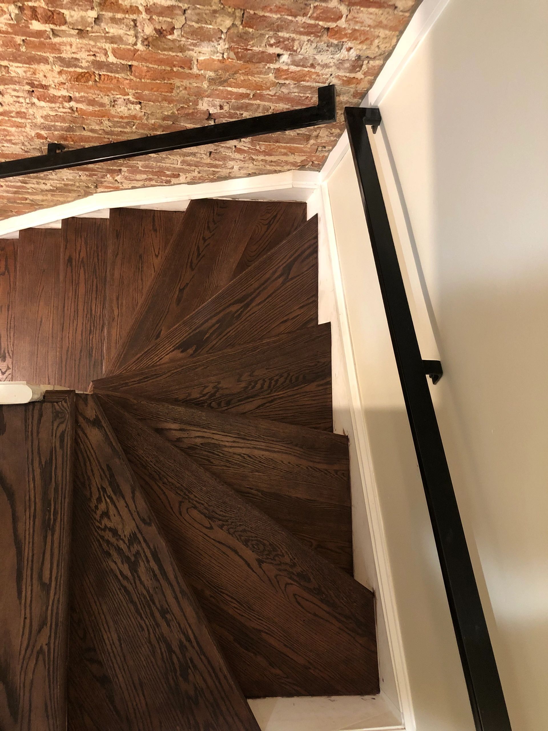 Staircase with dark wood steps